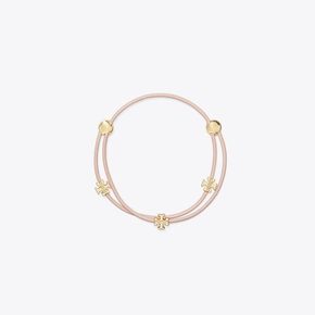 [시즌오프30%]토리버치 아이콘 멀티 랩 슬라이더 브레이슬릿 - 토리 골드 / 핑크