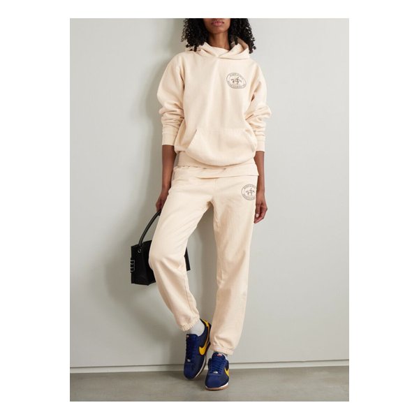 라이딩 클럽 프린트 코튼 저지 테이퍼드 스웨트팬츠 크림 1647597360122626