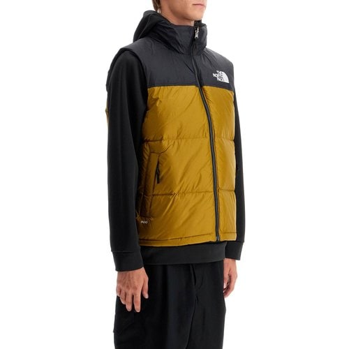 The North Face 1996 레트로 눕시 푸퍼 베스트 SPD0C957A