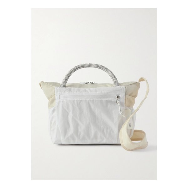 러닝 젠데이아 트랙 팩 미니 엘리트  셸 숄더 백 크림 46376663162991395