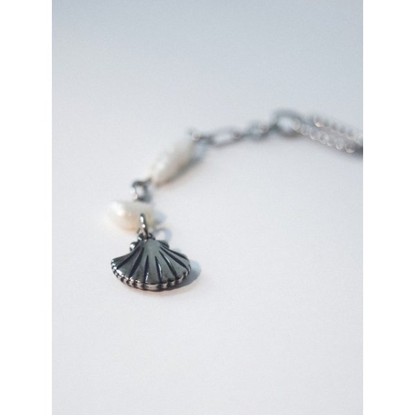 Pearl of seashell charm