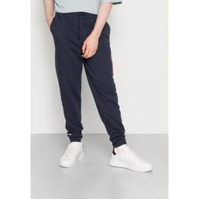 4342162 Tommy Hilfiger TJM COLLEGE ARCHIVE PANT - Tracksuit bottoms twilight navy